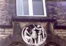 Carving of St. Cecilia on the wall of No. 65 Westbourne Road