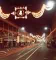 View: s45387 Christmas lights on The Moor showing (left) No.91 Blaskeys, wallpaper dealers and No.93 Greenwoods Menswear Ltd.
