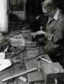 Mr H. Whitehead, putting together a pair of scissors, Frank Turton Ltd., scissor manufacturer, No. 72 Arundel Street