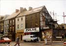 Nos. 8, Pulse, clothing, records and posters; 10, J.Turner, dental surgeon; 12 former hairdressers (scaffolding); 14, Picccolo Cafe; 16, Faulkners Billiard Hall above The Nameless Restaurant, Cambridge Street (near Barkers Pool)