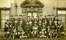 Scouts and leaders of the 2nd Sheffield (Darnall) Brigade troop of Boy Scouts on Air Raid voluntary active police duty during World War 1 at [Holy Trinity Vicarage, Darnall]