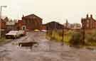 View: t08056 Derelict area at the entrance to Kelham Island showing (left to right) Woodhead Components Ltd, Globe Steel Works and (far right) Fat Cat PH on Alma Street