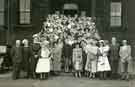 Annual reunion of Royal Infirmary Staff, Miss Clarke (3rd left front row), Matron outside Centenary House 
