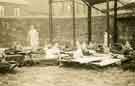 Children sleeping on camp beds on Ridgeway Road (open air school?)
