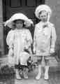 Portrait of two unspecifed children dressed for a wedding