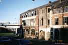 Derelict premises of Frank Cobb and Co. Ltd., silversmiths, Howard Works, Nos. 57 - 67 Broad Street showing (left) Parkway roundabout and Supertram bridge