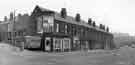 Terrace housing on (right) Upwell Street at the junction with Carlisle Street East showing (centre) No.127 Tony's, barbers