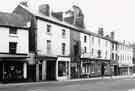 Leopold Street showing (r. to l.) H. L. Brown and Son Ltd., jewellers; Nos. 57, Shampoo, uni sex hairdressers; 55, Three Tuns public house