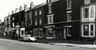 View: t11255 Shops on Ellesmere Road showing (l. to r.) Nos. 20-22 E. Hyman and Sons Ltd., house furnishers, No. 18 T. Radford and Son, butchers, Nos. 14-16 A. Myers and Son, bakers and sandwich shop, No. 12 Ellesmere Road Post Office, No. 10 The Woolly Jumper