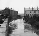 View: u06975 River Rother, looking north from the back-wall  at rear of No. 641 Retford Road across the river to Nos. 67 and 68 Kingston Place, Woodhouse Mill