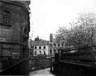 Norfolk Street from Cheney Row, showing premises of Thomas Morrison, tailor. The Town Hall is on the left, and the railings for St Paul's churchyard on the right.