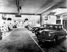 E.H. Pickford and Co. Ltd., motor car dealers - Derby showroom. Display of (possibly second-hand?) cars, c. 1950