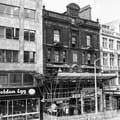 Fargate, the scaffolding on Winchester House being due to masonry falling off the building. Next door is the Golden Egg cafe and coffee shop, 11th May 1971 Fargate, the scaffolding on Winchester House being due to masonry falling off the building. Next door is the Golden Egg cafe and coffee shop, 11th May 1971