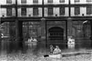View: u07707 Canoeing in the Sheffield Canal Basin, off Park Square, showing the Straddle Warehouse behind
