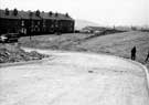 Construction of St John's Road looking towards Maltravers Road, with Wybourn Methodist Church in the background