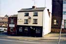 View: u08065 Fagan's public house (formerly the Barrel Inn), No. 69 Broad Lane, showing (left) National Windscreens, car windscreen fitters