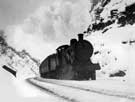 Steam locomotive in snow, approaching the northern entrance to Bradway Tunnel.
