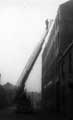 View: u08281 Fire engine removing dangerous parts of a roof on Sidney Street