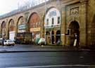 Shop units under the Wicker Arches on Walker Street, showing Barrels and Bottles, wine merchants: Wizard Motorcycles