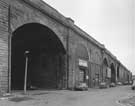 Victoria Station Railway Viaduct, Sussex Street showing premises of R W Lawson and Co. Ltd, wholesale hardware dealers