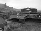 Unidentified derelict buildings, looking towards Sheaf Works, Maltravers Street (former works of Thomas Turton and Sons Ltd) across unidentified derelict buildings. Hyde Park flats are on the left..