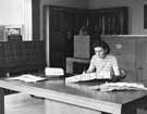 View: u08622 Mrs Gurney consulting a manuscript from the Special collection in the Local Studies Library, Central Library, Surrey Street