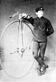 Postman with penny farthing bicycle Postman with penny farthing bicycle