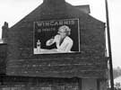 Advertising hoarding for 'Wincarnis' on side of No. 9 Sandygate Road