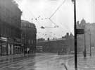 View from Pinstone Street looking towards Town Hall Square, Leopold Street and the top of Fargate with Arthur Wilson, Peck and Co., Ltd., pianoforte, organ and musical instrument dealers, Beethoven House to left of tram