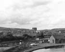 View: u08922 View from Sheffield Road of the former Hadfield Co. Ltd., East Hecla Steelworks being demolished, showing Tinsley Gas holders in the background and Tinsley Canal in the foreground