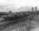 View from Sheffield Road of the former Hadfield Co. Ltd., East Hecla Steelworks being demolished, showing Tinsley Gas holders in the background and Tinsley Canal in the foreground
