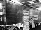 Matthes Stainless Steel clad van being loaded at the Sunshine bread bakery.. Matthes Stainless Steel clad van being loaded at the Sunshine bread bakery..