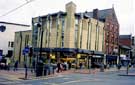 Fitzalan Square, showing No. 1 Cooplands Ltd., bakers and Nobles Amusements. Next to the modern building is the former Bell Hotel