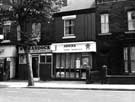 Ecclesall Road showing No. 305 H. Braddock, betting shop and No. 307 Ashoka, Indian restaurant