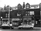 Shops on Ecclesall Road showing (l. to r.) No. 419 Baby Fashions, No. 421 A. I. Winston, chemist and No. 423 G. and E. Marriot, confectioners