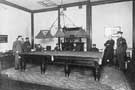 World War 1 soldiers playing either snooker or billiards in an unidentified hall.