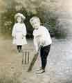 Dorothy Caroline Barr playing cricket with her brother Harold Frederick Barr, c. 1908