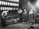 View: u10112 Preparing to 'double' crucibles at Charles Cammell and Co. Ltd., Cyclops Works, Savile Street, Attercliffe 