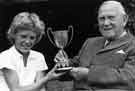 Frederick Carr, former Chief Superintendant of Physical Education in Sheffield, presenting a trophy - event and name of girl unknown.