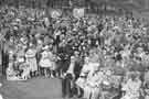 Whitsundtide sing in Hillsborough Park, c. 1958 including banners belonging to Hillsborough Baptist Church and Bamforth Street Church.