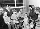 Grace Owen (benefactor of Grace Owen Nursery School, Hague Row, Park Hill Flats) with parents and children at the school at its official opening.  On the far right is Miss Cole, its first headteacher.