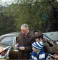 Bill Shankly (1913-1981), Liverpool Football Club manager signing autographs before game at Hillsborough
