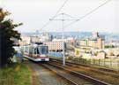 Supertram, with the Canal Basin in the background showing the Straddle Warehouse in the centre. Supertram, with the Canal Basin in the background showing the Straddle Warehouse in the centre.