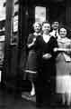 Lily and Arthur Barber with their sailor son Billy Barber and his girlfriend outside their grocery corner shop at No. 79 Carver Street, c. 1950