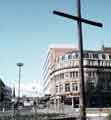 Easter cross in Fargate at junction with Leopold Street showing (back) Wilson Peck Ltd., music warehouse, Nos. 66-70 Leopold Street