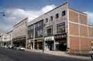 Shops on the Moor showing (l. to r.) (Nos. 43 - 51) British Home Stores, (No. 65) L. Blake Ltd., childrens outfitters and (No. 67) March the Tailor 
