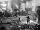 Brown Bayley's Steel Works Ltd - foundry 'as it is today. Mr Williams at end of moulds on the left . His son, Ernest, casting mould'