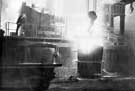 Thomas Firth and Sons Ltd: Siemens-Martin Furnace - tapping the furnace - running molten steel into a ladle