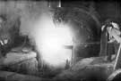 Thomas Firth and Sons Ltd: Stock oil fired furnace - pouring the molten steel into the ladle