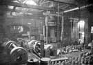 Thomas Firth and Sons Ltd: hollow forging - vertical and horizontal hydraulic presses for punching and drawing projectiles and hollow caps.